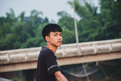 Portrait of young man looking away