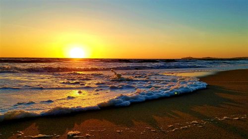 Scenic view of sea at sunset