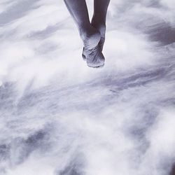 Low section of woman against clear sky