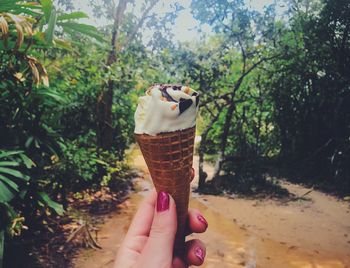 Hand holding ice cream cone