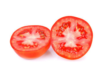 Close-up of chopped tomatoes against white background
