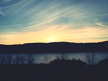Scenic view of lake at sunset