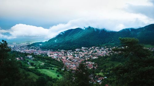 High angle view of trees and mountains against sky