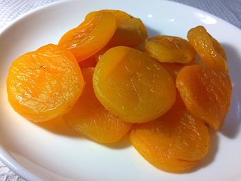 High angle view of orange fruits in plate