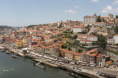 High angle view of townscape by canal in city