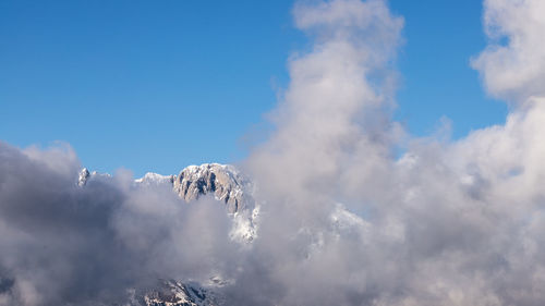 Low angle view of snow against sky