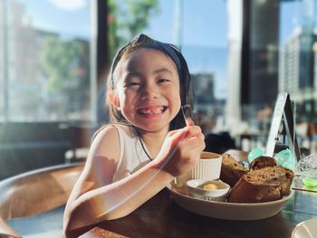 Portrait of young woman cute girl having food