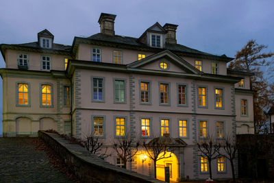 Exterior of old building against sky at dusk