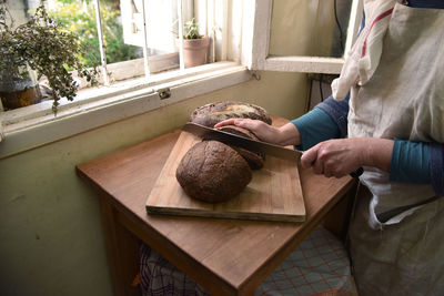 Midsection of man preparing food at home