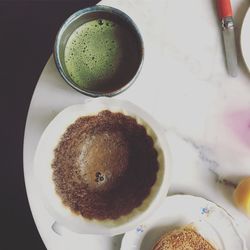 High angle view of cappuccino served on table