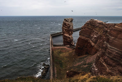 High angle view of sea shore against sky