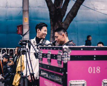 People standing on stage at music concert
