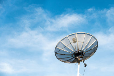 Low angle view of satellite dish against blue sky