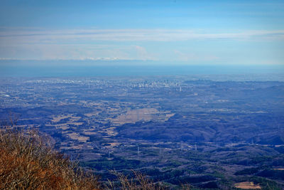 Aerial view of landscape and sea against sky