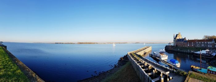 High angle view of river by city against clear sky