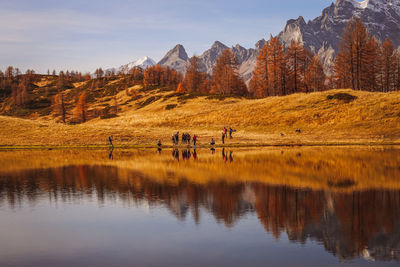 Scenic view of lake and mountains against sky