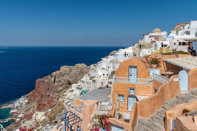 High angle view of buildings by sea