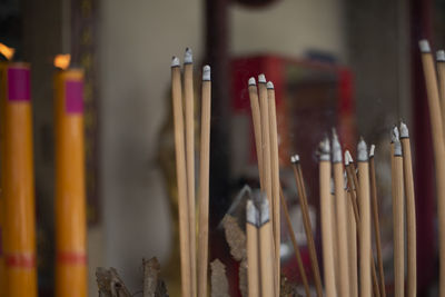 Close-up of candles in temple