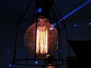 Low angle view of illuminated lights at night
