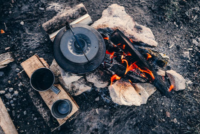 High angle view of fire on barbecue grill