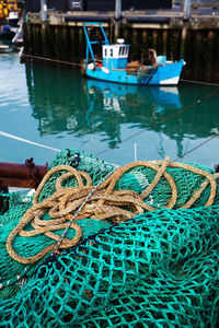 Fishing boats moored at harbor