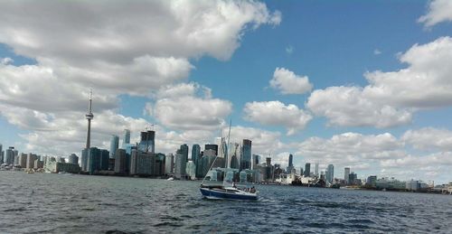 Scenic view of sea and buildings against sky