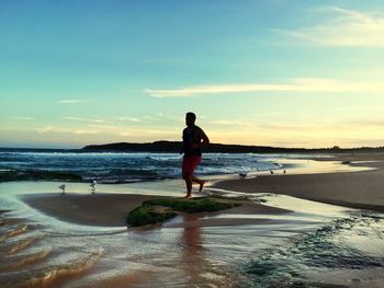 Scenic view of sea at sunset