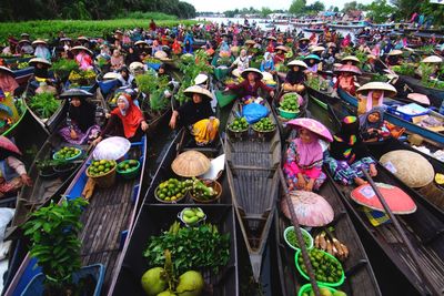 Group of people at market stall