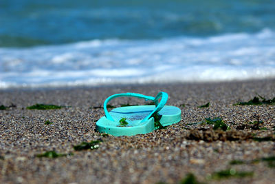 Close-up of toy on sand