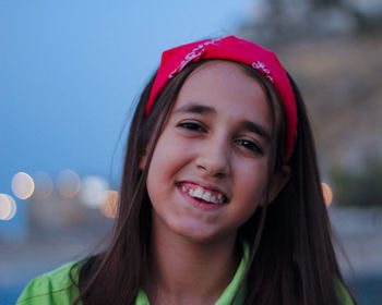 Close-up portrait of a smiling young woman