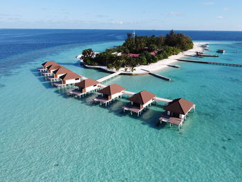 High angle view of swimming pool by sea against sky