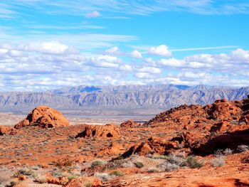Rock formations on landscape against sky