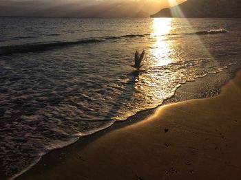 View of beach at sunset