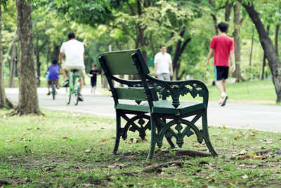 Rear view of man and woman in park