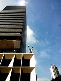 Low angle view of statue against cloudy sky