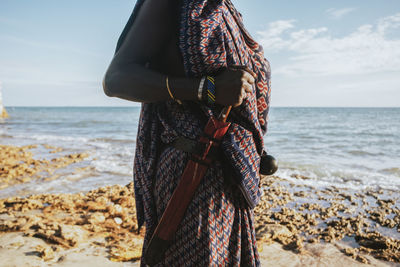 Close up of maasai warrior with a traditional knife attached to a belt