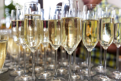 Close-up of wine glasses on table