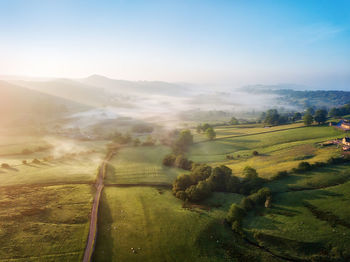 Scenic view of agricultural landscape against sky