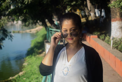 Portrait of young woman in sunglasses