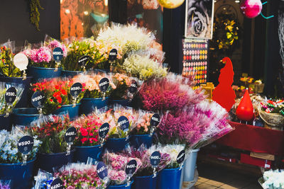 Flower pots for sale at market stall