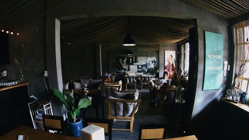 Chairs and tables in illuminated room