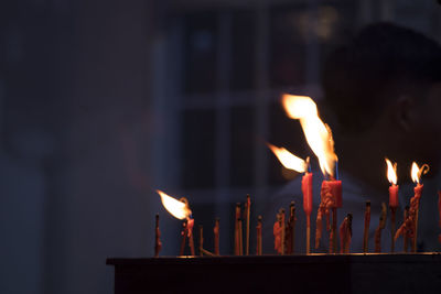 Close-up of burning candles