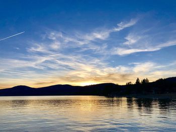 Scenic view of lake against sky during sunset