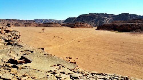 High angle view of desert against mountain range