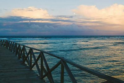 Scenic view of sea against cloudy sky