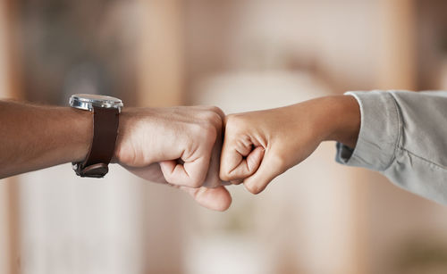 Close-up of couple holding hands