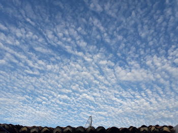 Low angle view of clouds over landscape