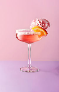Close-up of drink against yellow background