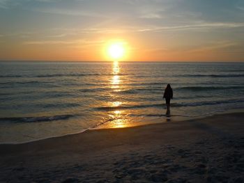 Scenic view of sea at sunset