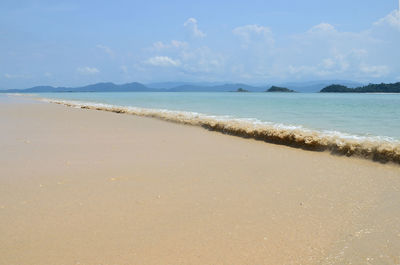 Scenic view of beach against sky